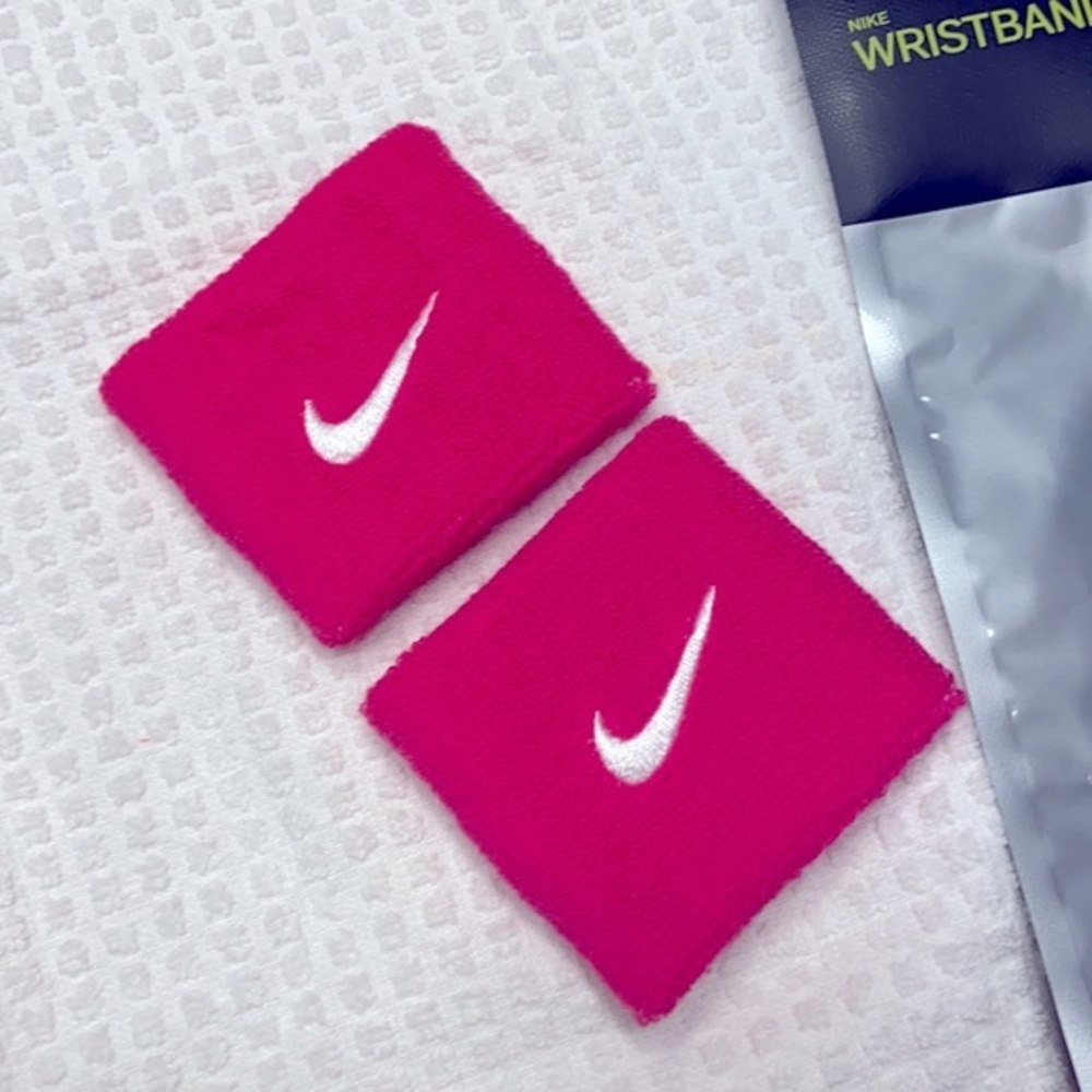 Nike Swoosh 3” pair wristbands.  Pink